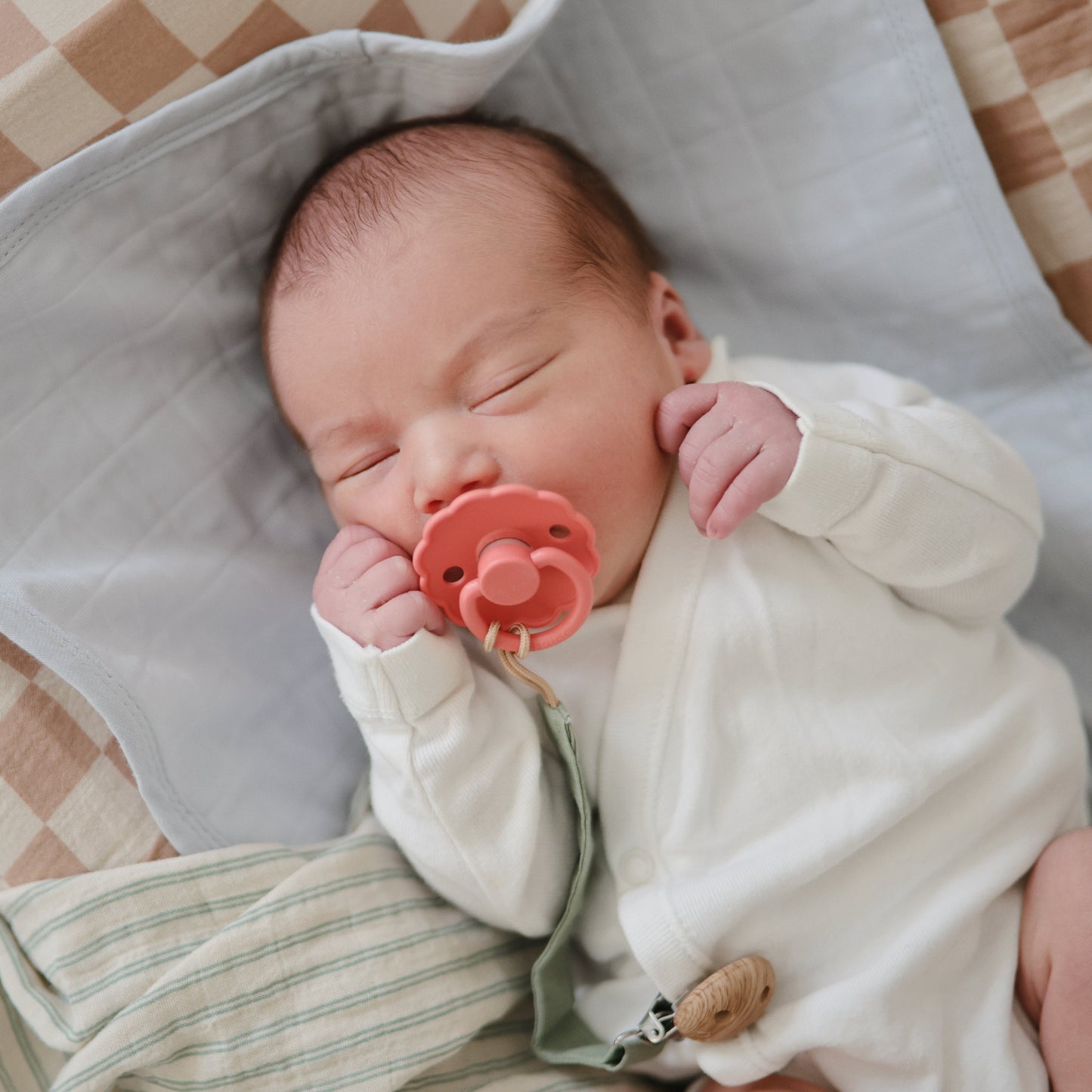 Baby with FRIGG Natural rubber pacifier