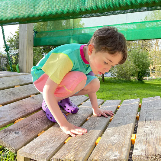 Boy wearing Slugs & Snails organic Waffle top & shorts set- '90s neon