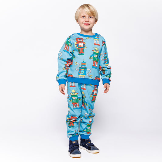 Boy wearing Småfolk Organic Boys' Sweatpants- Robots, Blue Atoll