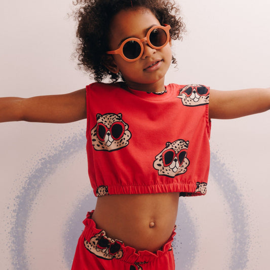 Girl wearing Dear Sophie organic crop top- hamster red