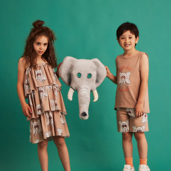 Boy wearing Dear Sophie organic Shorts- elephant beige