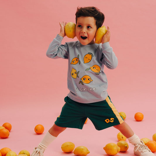 Boy wearing Dear Sophie organic Shorts- green