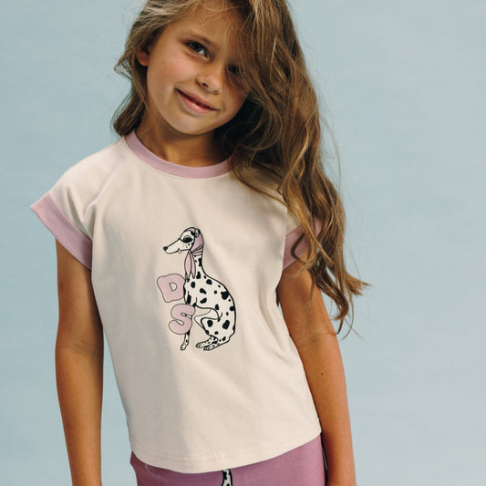 Girl wearing Dear Sophie organic Short sleeve t-shirt- dalmatian ecru