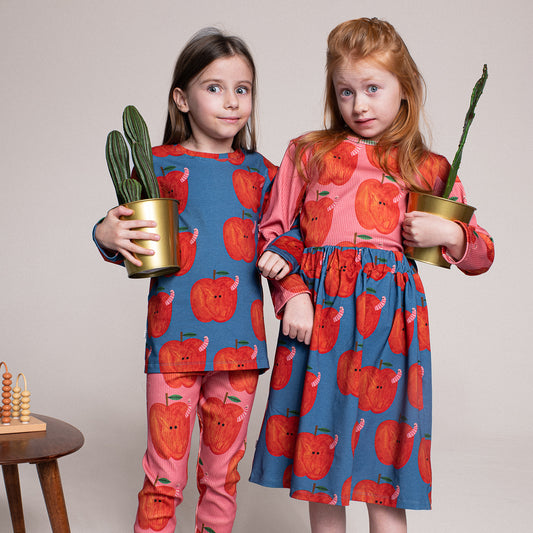 Girl wearing Don't Grow Up organic Ribbed long sleeve t-shirt- apples pink