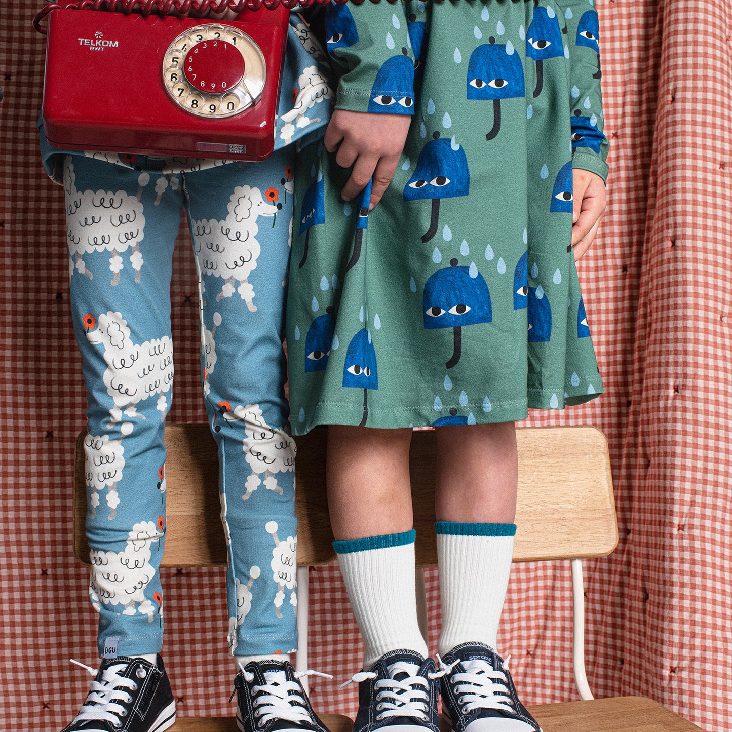 Girl wearing Don't Grow Up organic Leggings- dogs blue