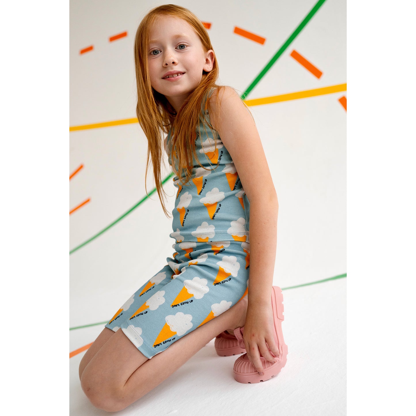 Girl wearing Don't Grow Up organic Ribbed bike shorts- blue ice cream