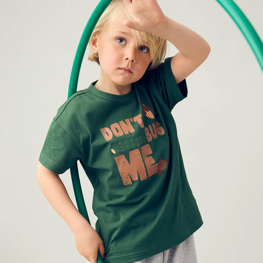 Boy wearing Fred's World organic Short sleeved t-shirt- don't bug me