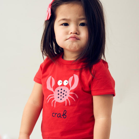 Girl wearing Fred's World organic Short sleeved t-shirt- crab