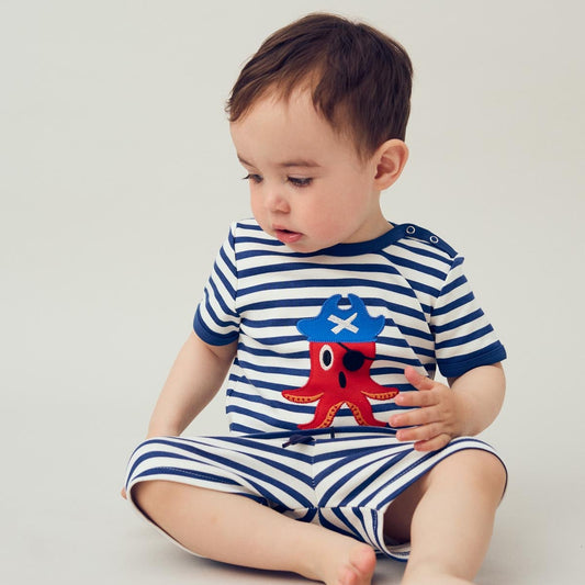 Baby wearing Fred's World organic Short sleeved t-shirt- starfish pirate appliqué