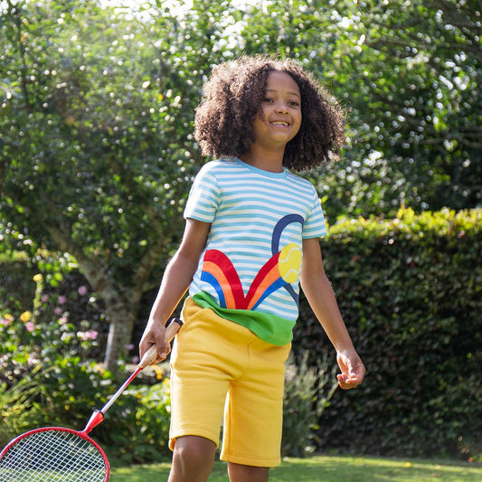 Girl wearing Frugi Organic Shorts- bumblebee yellow