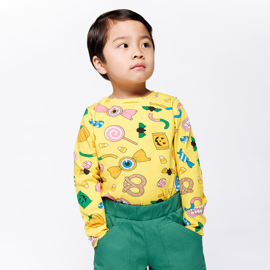 Boy wearing Småfolk Organic Long Sleeved Kids' T-shirt- Halloween Candy, Yellow