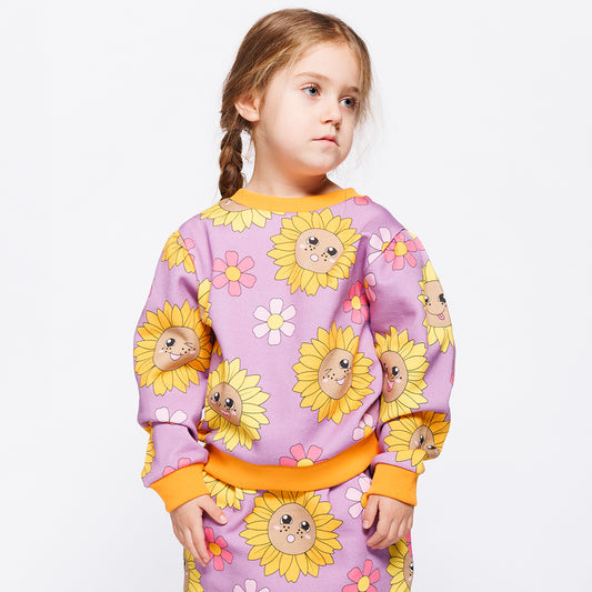 Girl wearing Småfolk Organic Girls' Sweatshirt- Sunflowers, Purple Iris