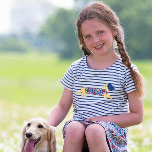 Girl wearing Kite organic T-shirt- dachshund appliqué