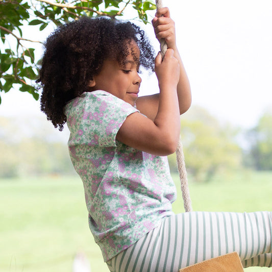 Girl wearing Kite organic Flower patch top