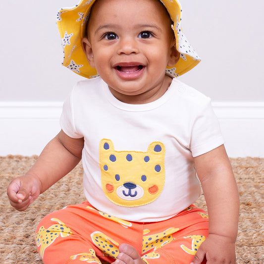 Baby wearing Kite organic Hello cub bodysuit