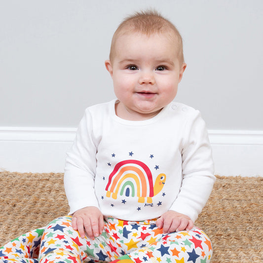 Baby wearing Kite organic Rainbow turtle bodysuit