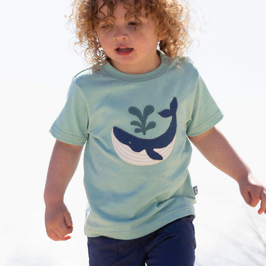 Boy wearing Kite organic T-shirt- whale appliqué