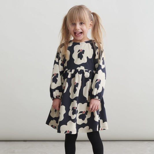 Girl wearing Mainio organic dress- autumn viola