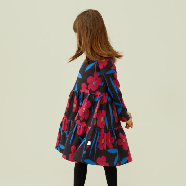 Girl wearing Mainio organic Mysterious blooms jacquard dress