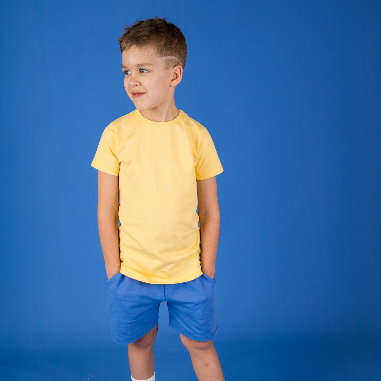 Boy wearing Mullido Shorts- blue