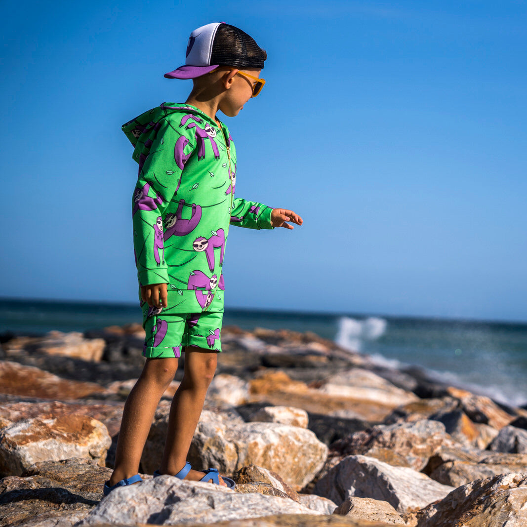Boy wearing Mullido organic Shorts- green sloth