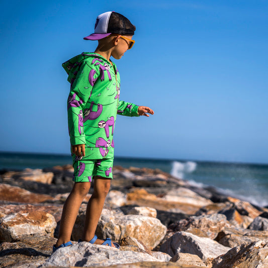 Boy wearing Mullido organic Shorts- green sloth