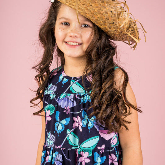 Girl wearing Mullido organic Sleeveless dress- butterflies, navy