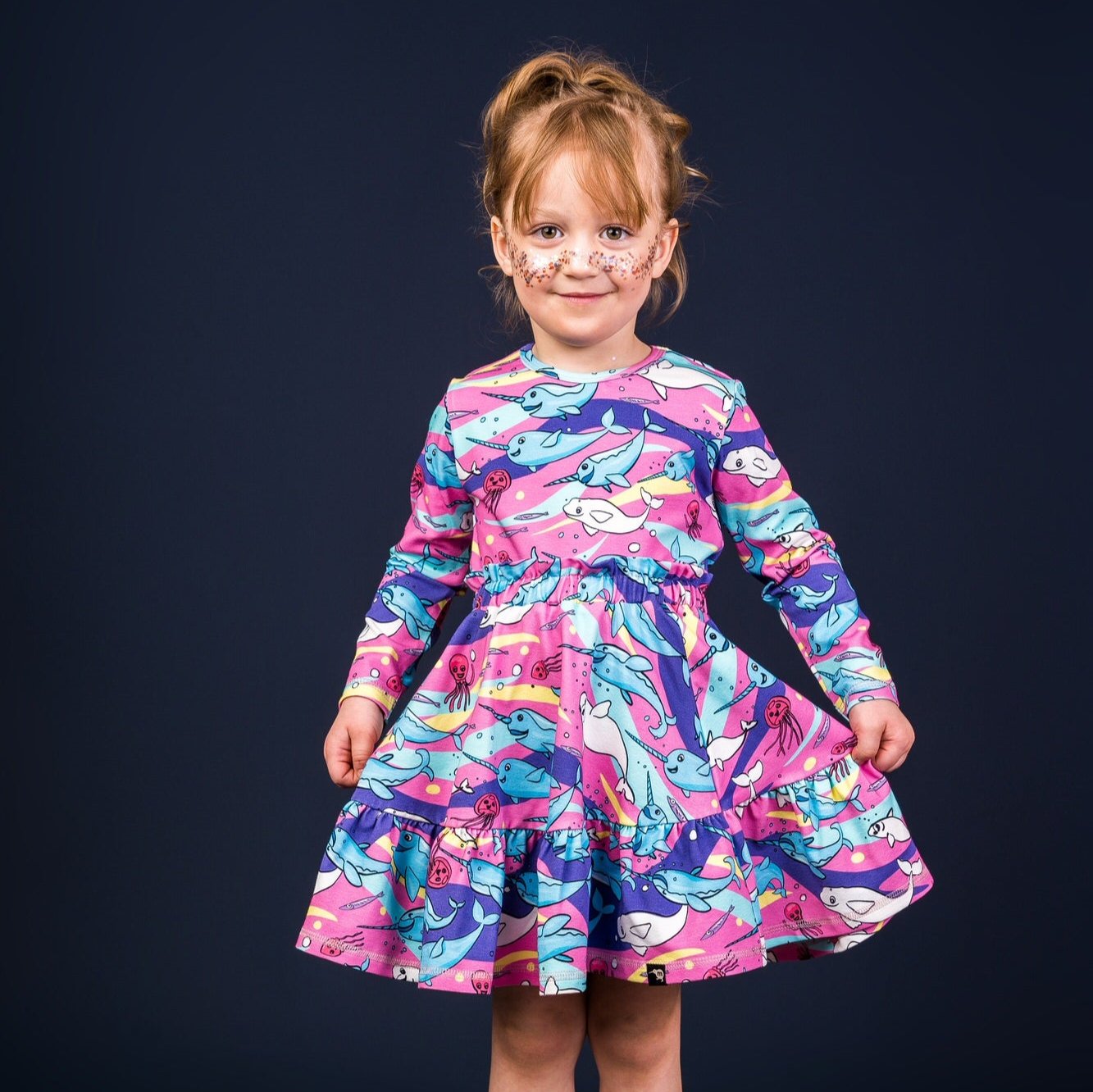 Girl wearing Mullido organic Long sleeved top- pink narwhal