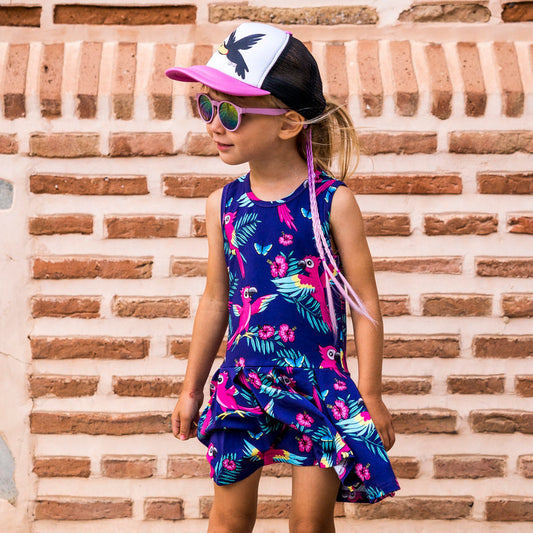 Girl wearing Mullido organic Sleeveless dress- purple parrot
