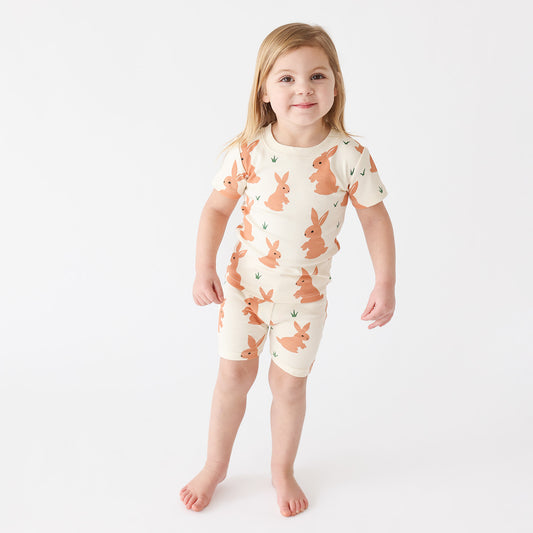 Girl wearing Parade Organics Pajama set, short- bunnies
