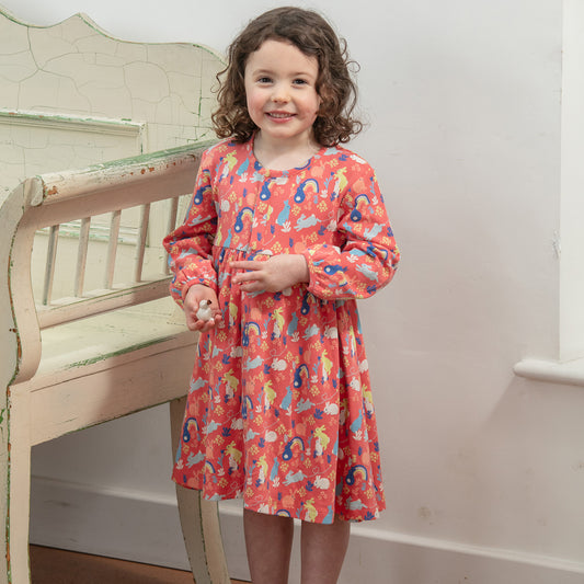 Girl wearing Piccalilly organic Long sleeve dress- bunny hop