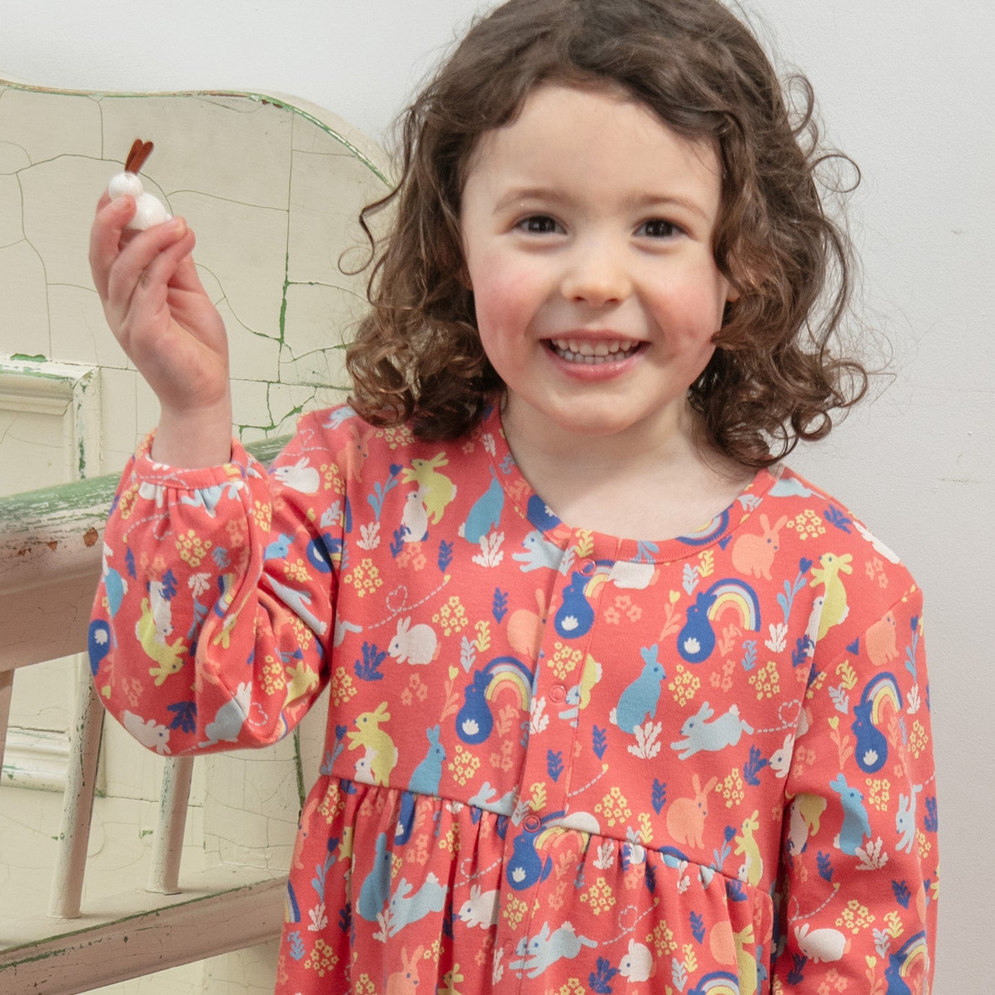 Girl wearing Piccalilly organic Long sleeve dress- bunny hop