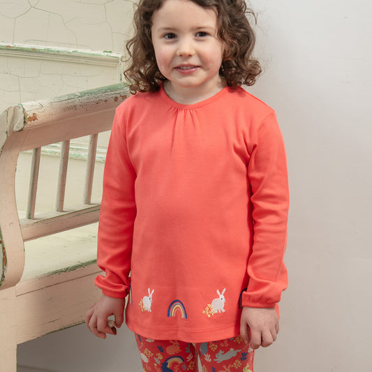 Girl wearing Piccalilly organic Tunic- bunny appliqué