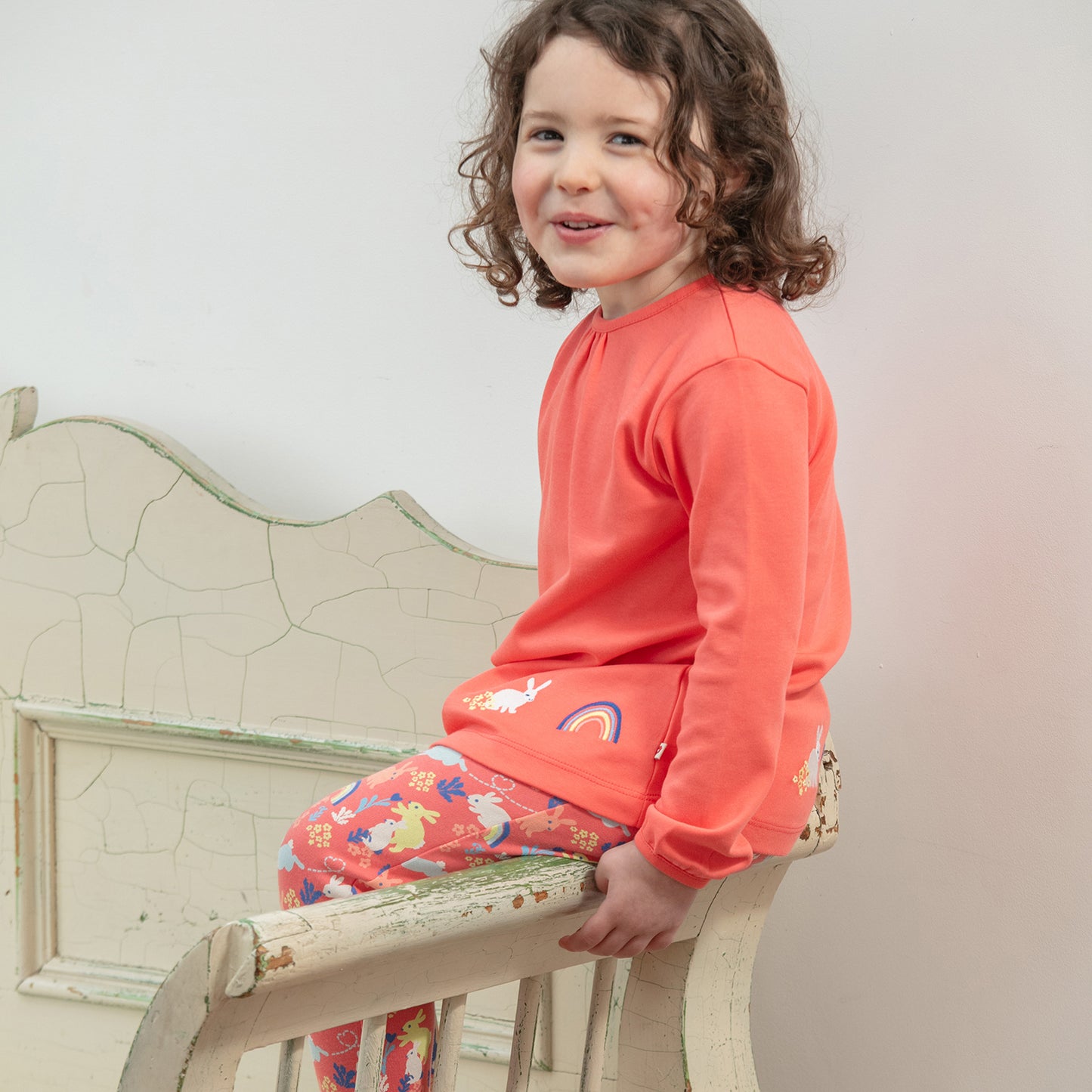 Girl wearing Piccalilly organic Tunic- bunny appliqué