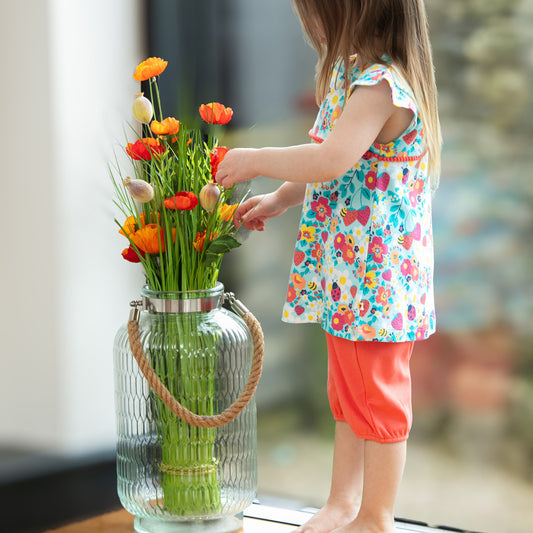 Girl wearing Piccalilly organic Tunic & shorts playset- strawberry fields