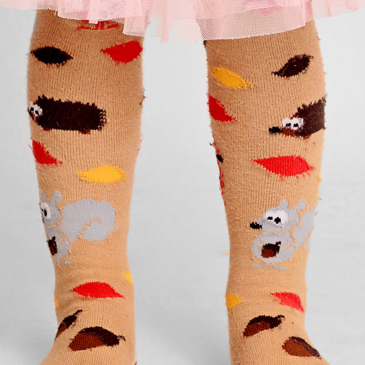 Girl wearing Slugs & Snails organic Autumn patterned tights