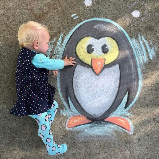 Baby wearing Slugs & Snails organic Penguin patterned tights