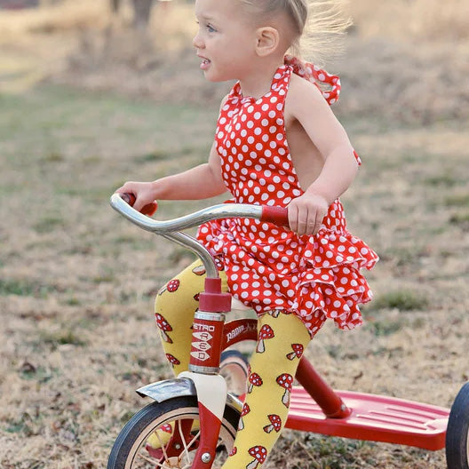 Girl wearing Slugs & Snails organic Mushroom patterned tights