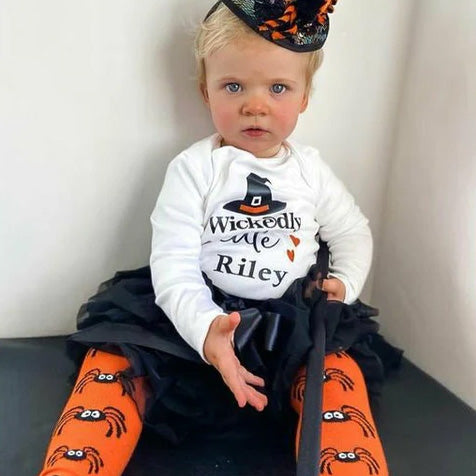 Girl wearing Slugs & Snails organic Spider patterned tights