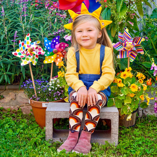 Girl wearing Slugs & Snails organic Sunrise patterned tights