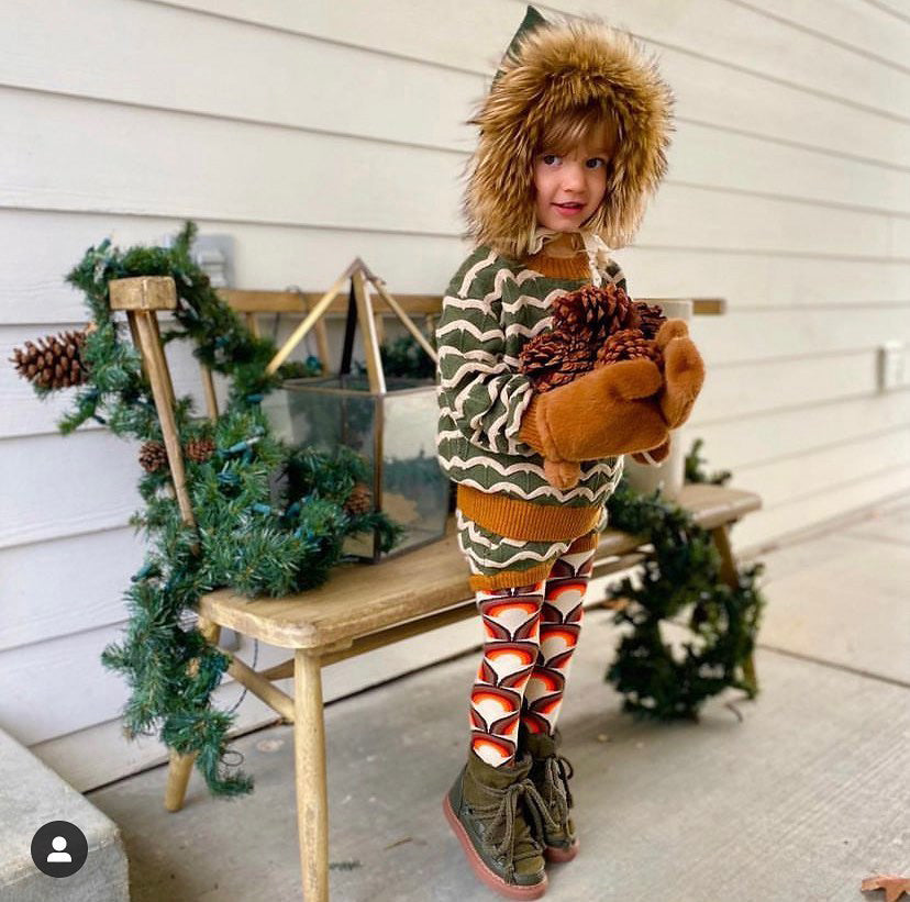 Boy wearing Slugs & Snails organic Sunrise patterned tights