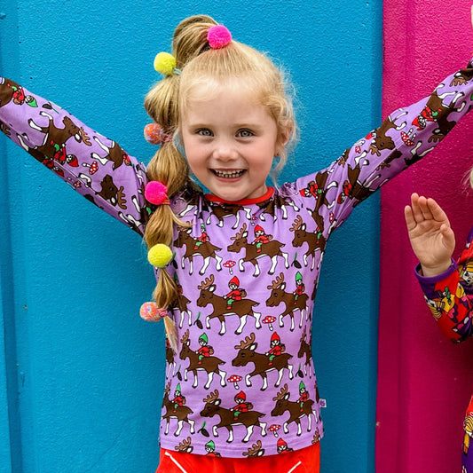 Girl wearing Smafolk organic Reindeer t-shirt, viola