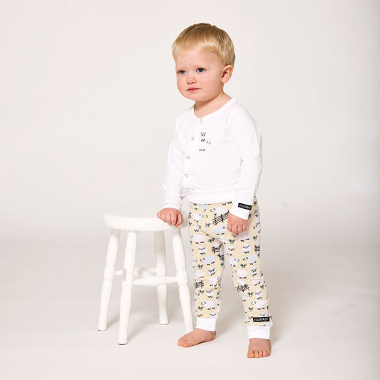 Baby wearing Villervalla organic Baby pants- sheep
