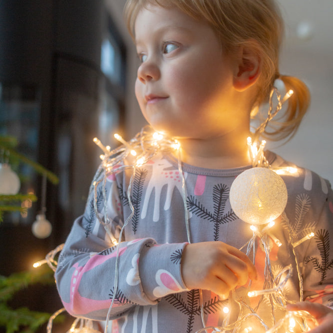 Girk wearing PaaPii Aamu nightgown- gray/light pink bambi