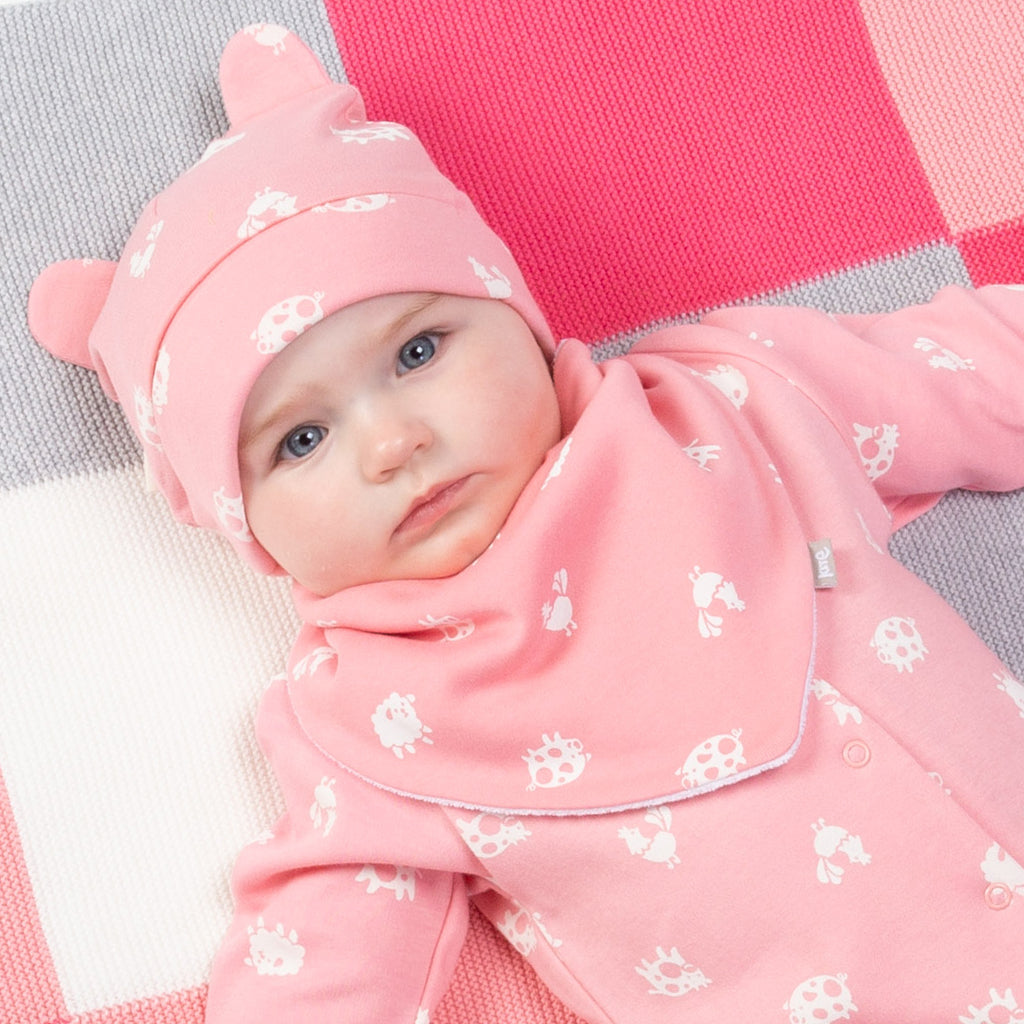 Baby wearing Kite pink polka farm hat