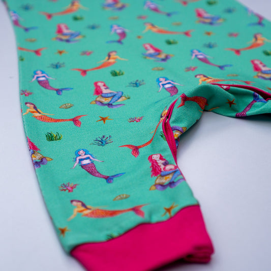 JECO mystical mermaids in turquoise dungarees, closeup