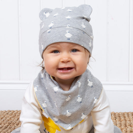 Baby wearing Kite polka duck hat