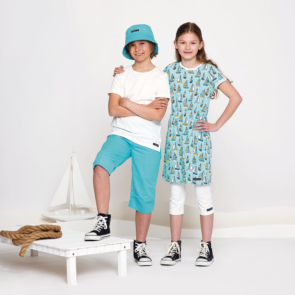 Girl wearing Villervalla organic Short sleeve dress- sailboat