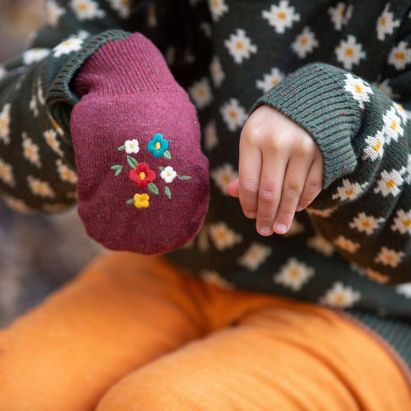 Child wearing Little Green Radicals organic Knitted mittens- hazelnut embroidered