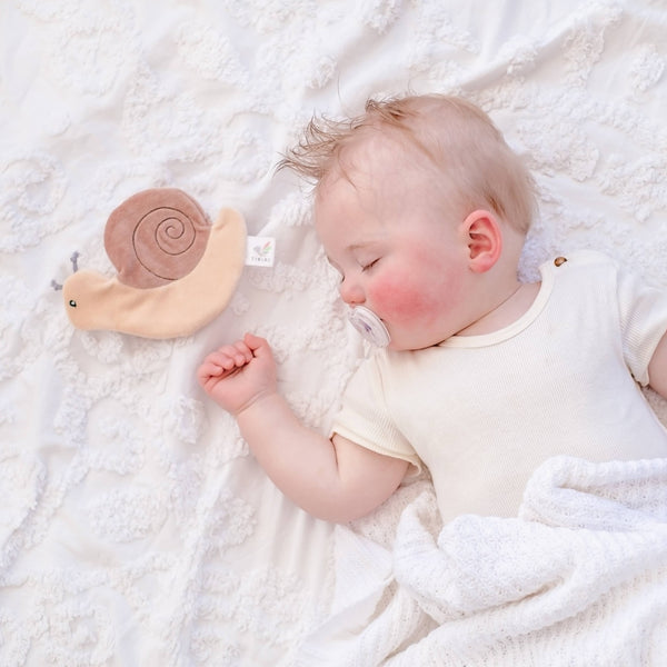 Baby with Tikiri Toys organic Crinkle toy- snail